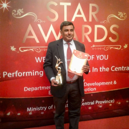 Person holding award and certificate.Our Achievements for the hard work. Vanilla Lanka Pvt Ltd